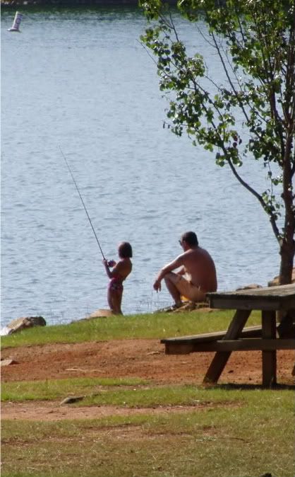 Little boy fishing at the dam