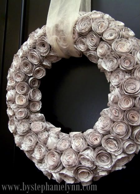 http://www.bystephanielynn.com/2010/11/diy-faux-curled-rosewood-wreath-made-from-rolled-recycled-book-pages.html